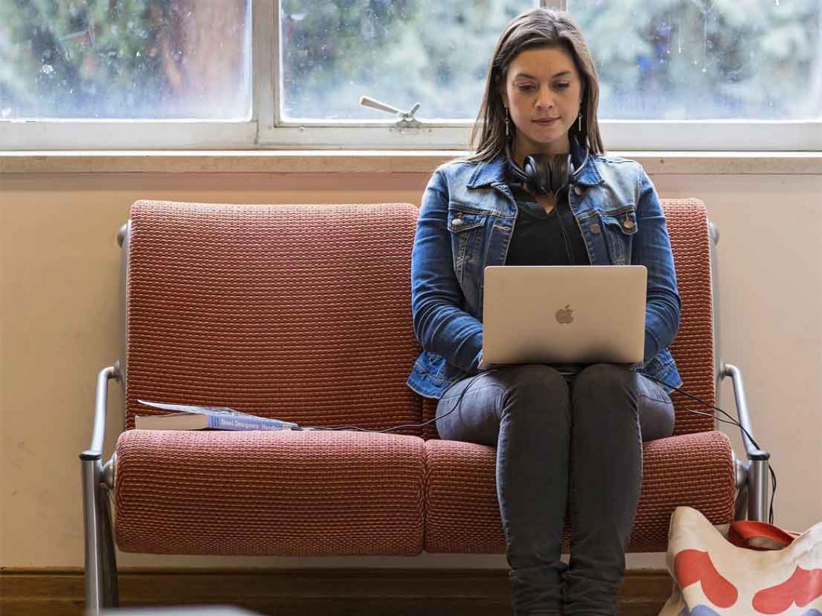 Student sitting with laptop