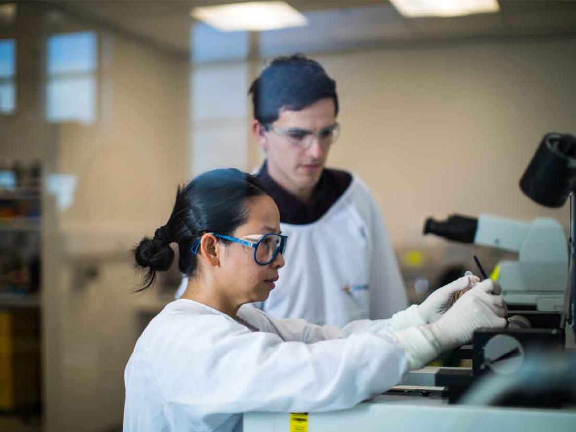 Student with teacher in AHMS building lab